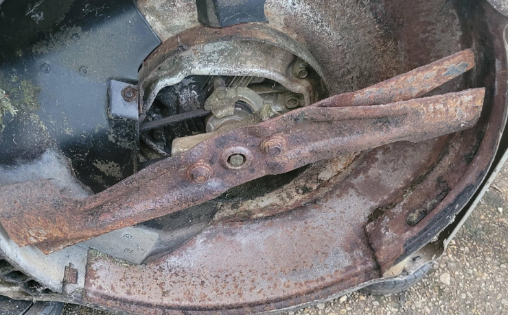 rusted deck of a lawn mower